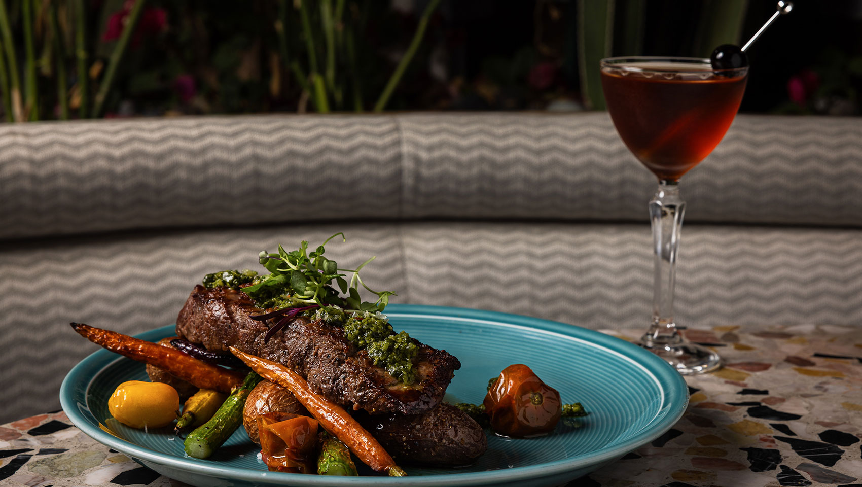Steak dish and cocktail
