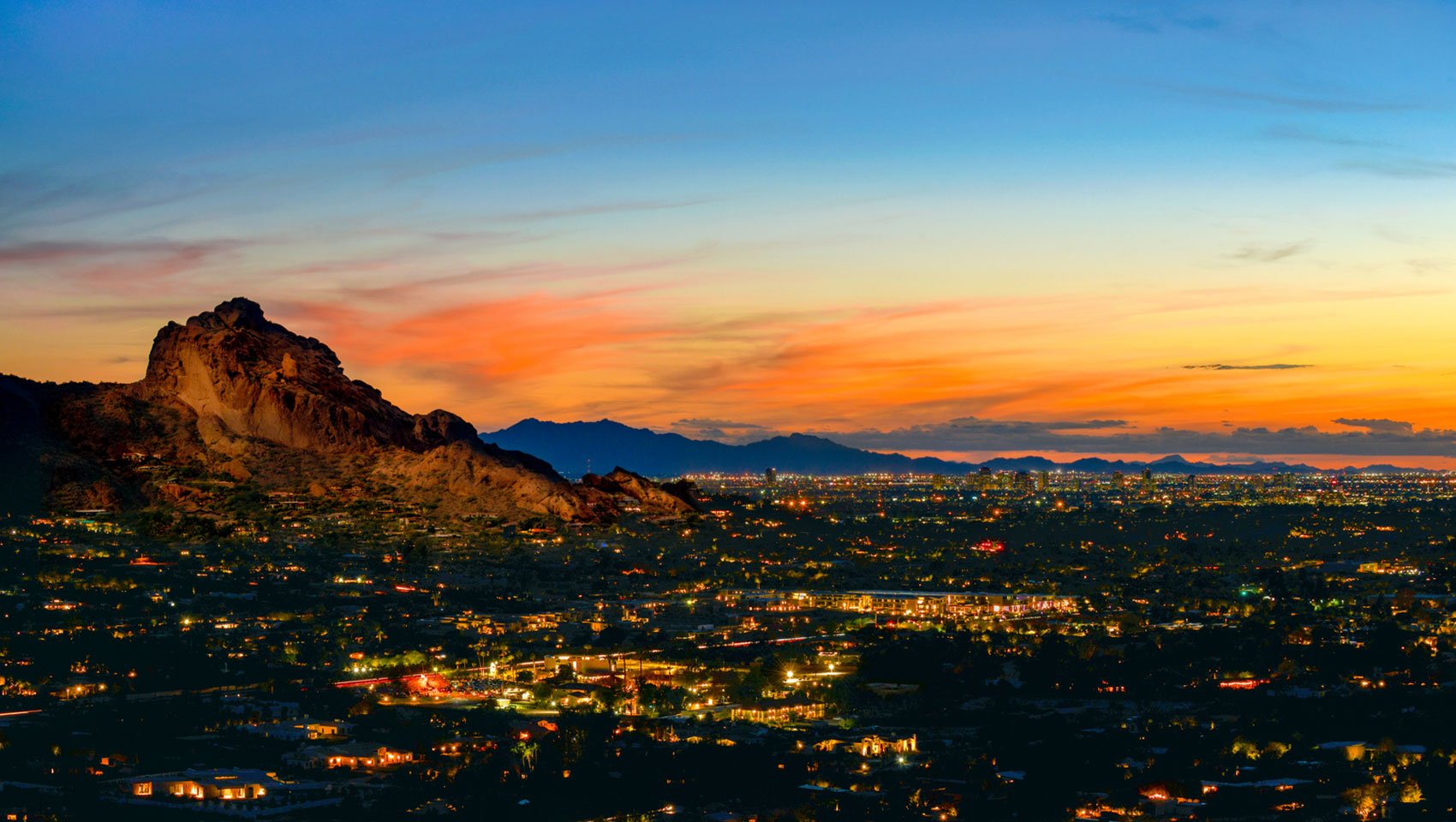 Sun setting over the Phoenix mountain skyline