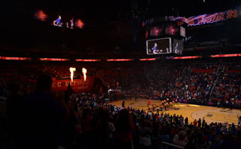Phoenix Mercury home game at Talking Stick Resort Arena with the lights down low and flames blowing straight up on both sides of the front of the team entrance of the court