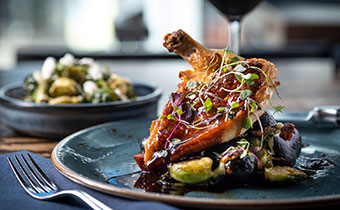 food on a table with a glass of wine