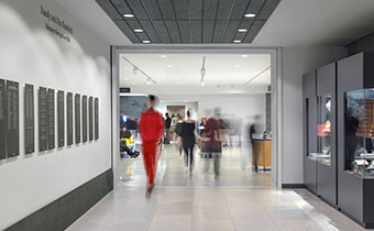 a group of people walking in a hallway